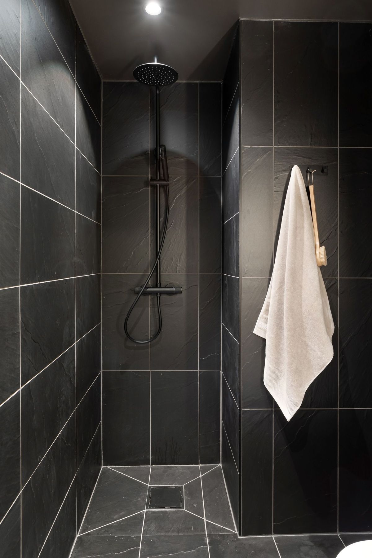 Clean, private hot shower stall at Big Rig Sleep Solution